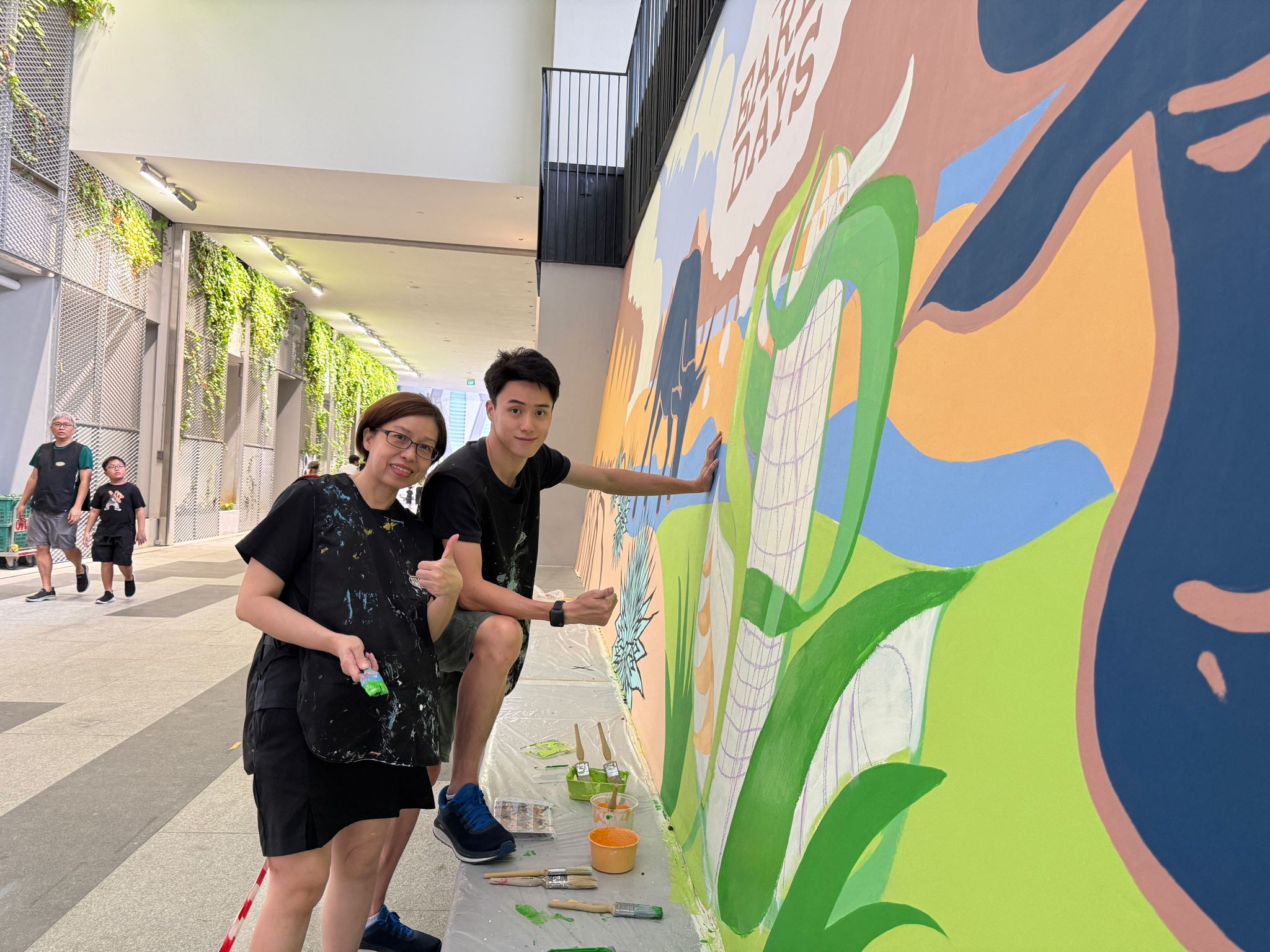 Behind the scenes photo of early mural concept sketching